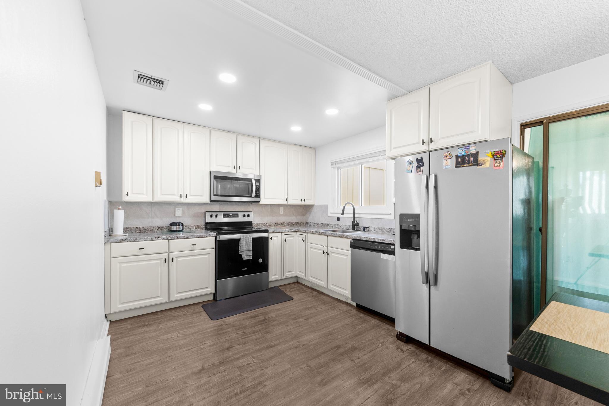 25C Pitman Road, Unit B Monroe Township, NJ 08831 - Photo 11 of 29 a kitchen with cabinets stainless steel appliances and sink