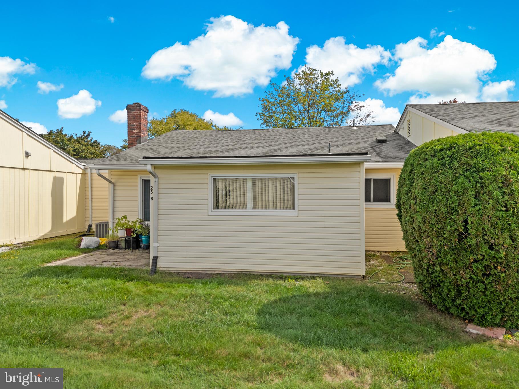 25C Pitman Road, Unit B Monroe Township, NJ 08831 - Photo 25 of 29 a front view of a house with a garden