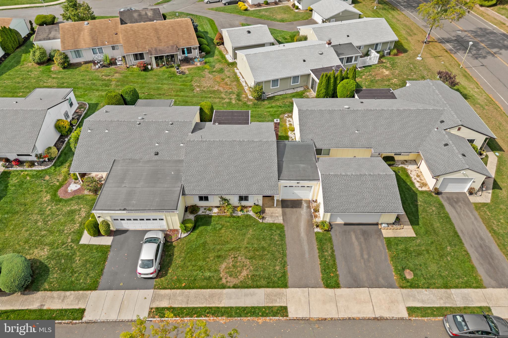 25C Pitman Road, Unit B Monroe Township, NJ 08831 - Photo 28 of 29 an aerial view of residential houses with outdoor space and parking