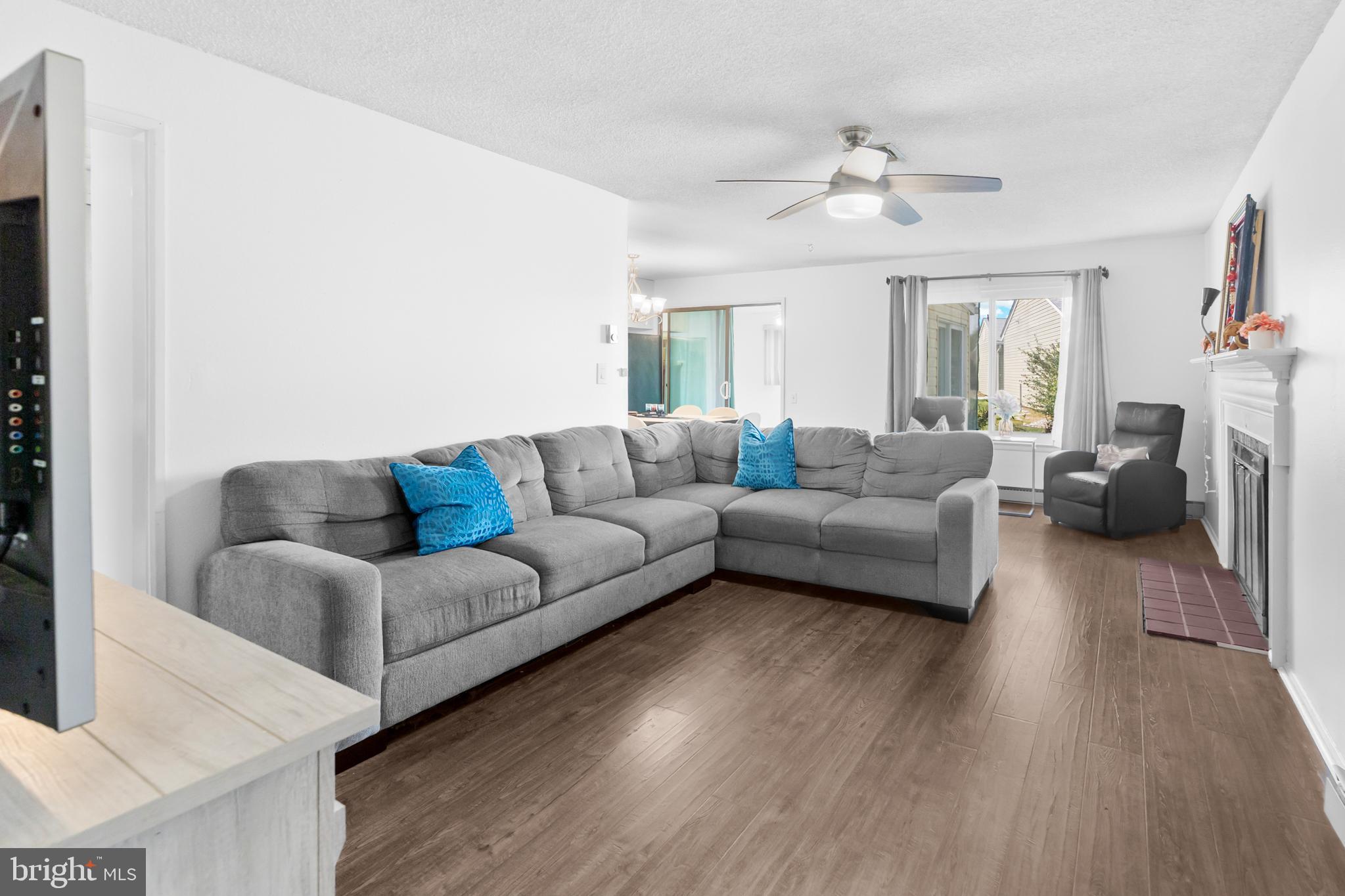 25C Pitman Road, Unit B Monroe Township, NJ 08831 - Photo 5 of 29 a living room with furniture and a large window