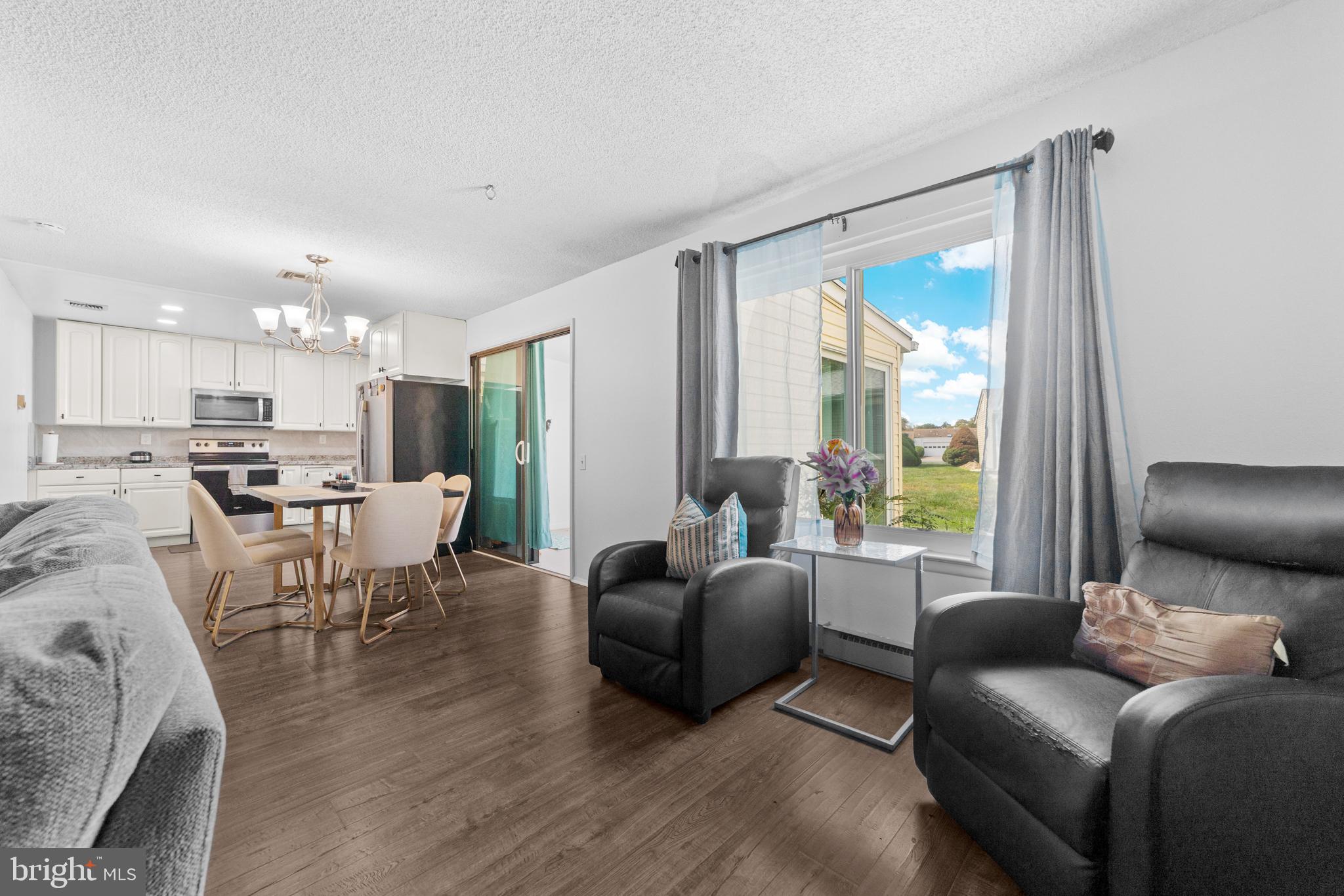 25C Pitman Road, Unit B Monroe Township, NJ 08831 - Photo 8 of 29 a living room with furniture and a large window