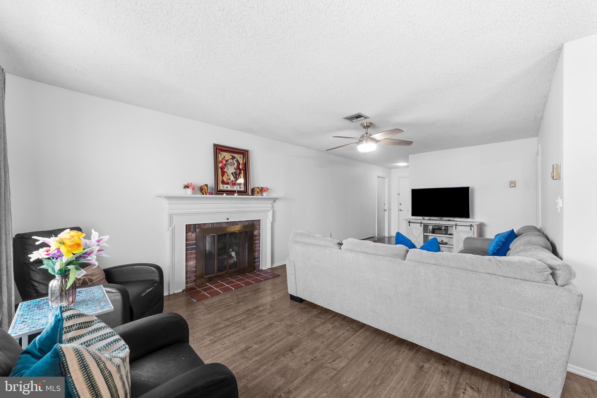 25C Pitman Road, Unit B Monroe Township, NJ 08831 - Photo 10 of 29 a living room with furniture and a fireplace
