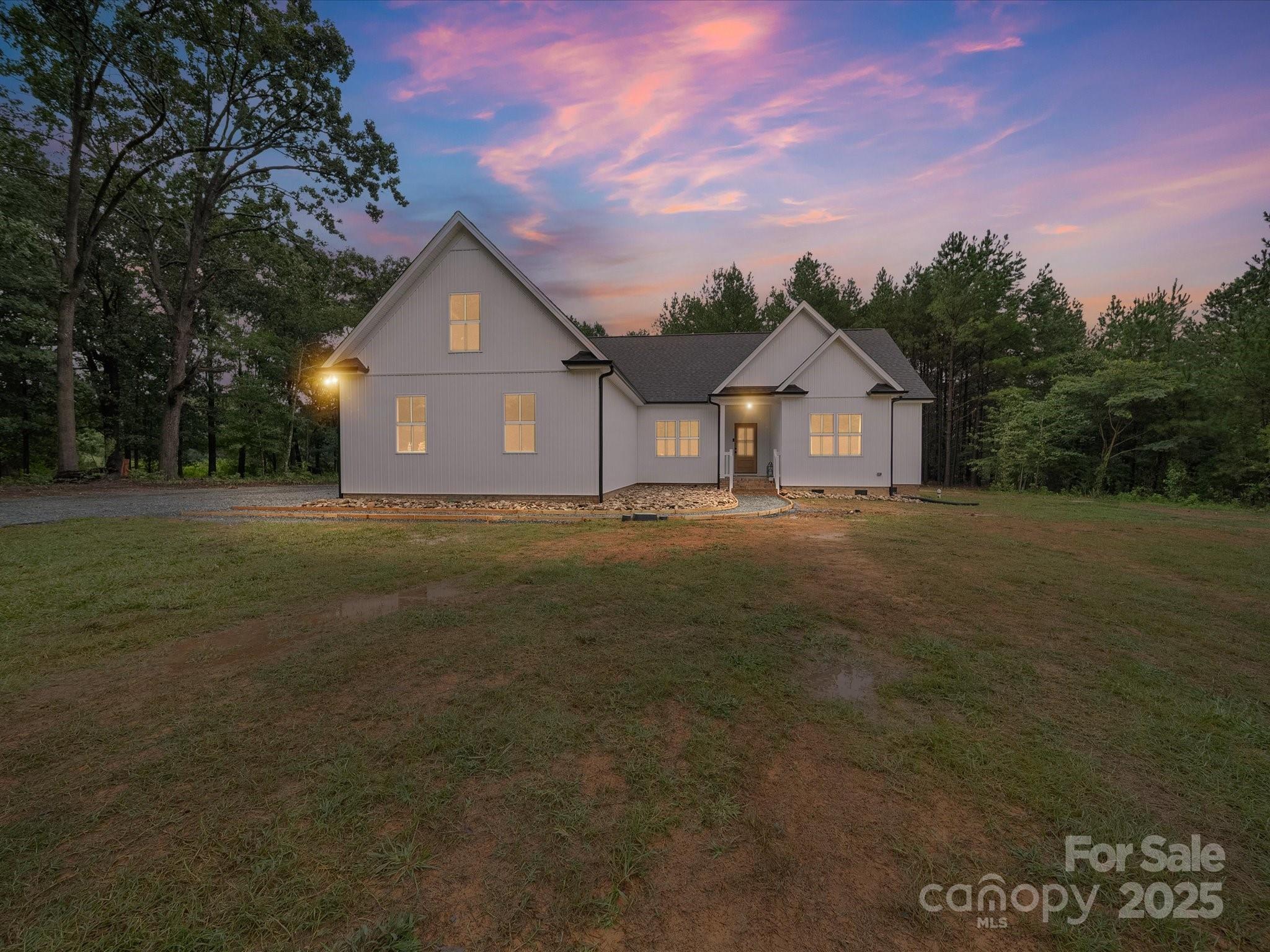 5408 Unionville Road Monroe, NC 28110 - Photo 1 of 31 a front view of a house with a garden