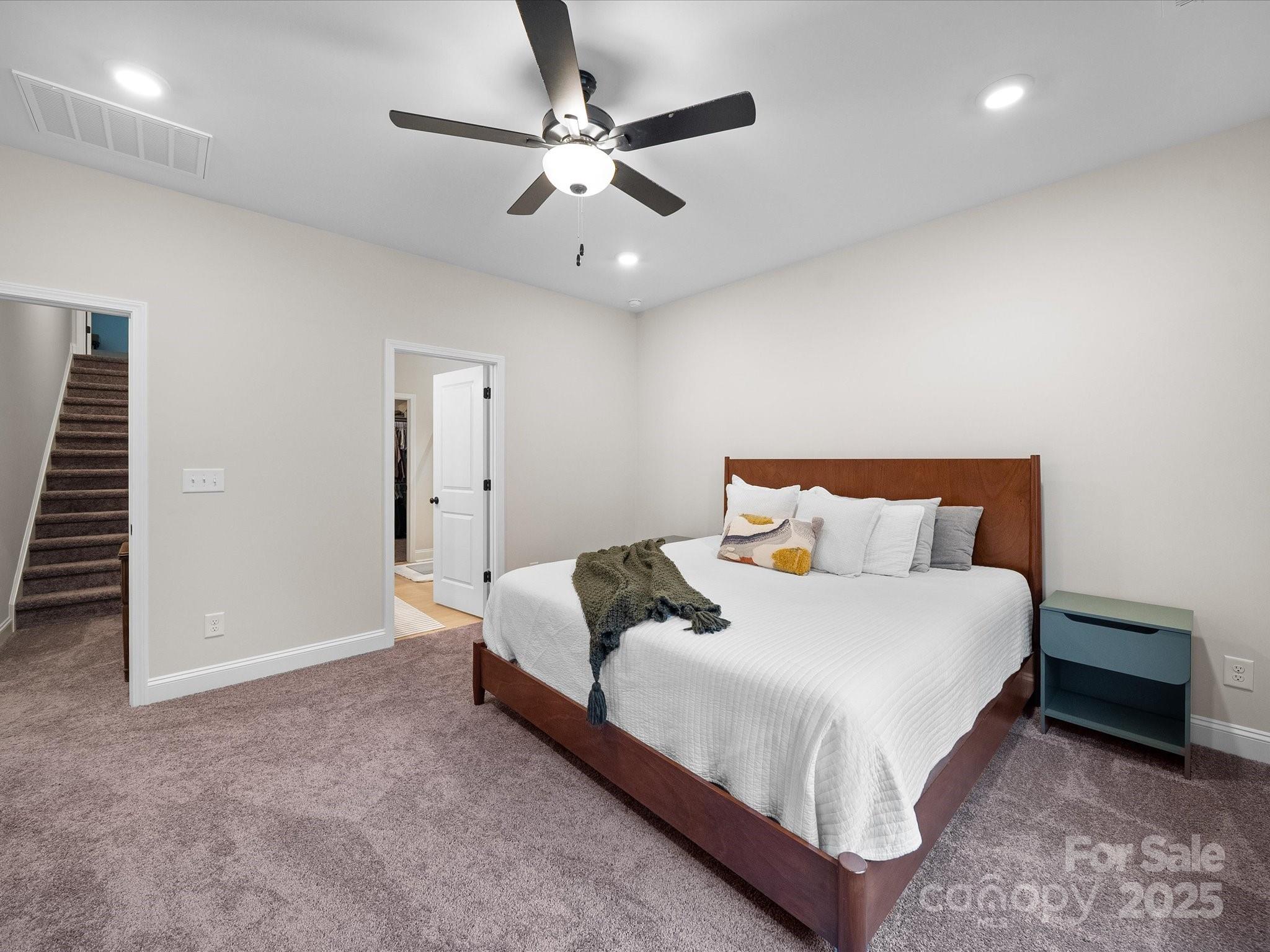 5408 Unionville Road Monroe, NC 28110 - Photo 16 of 31 a bedroom with bed and a chandelier