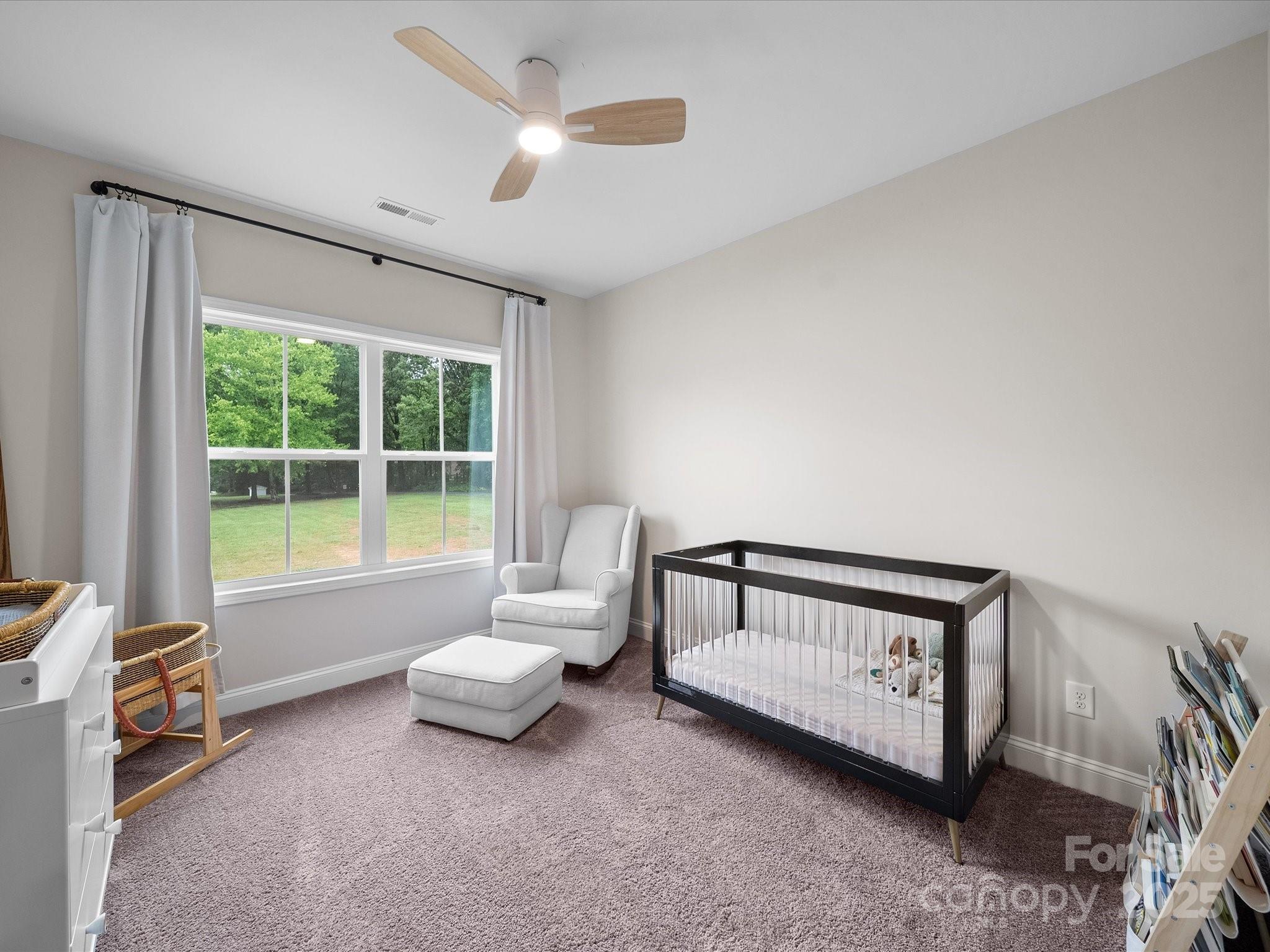 5408 Unionville Road Monroe, NC 28110 - Photo 20 of 31 a spacious bedroom with a bed and a window
