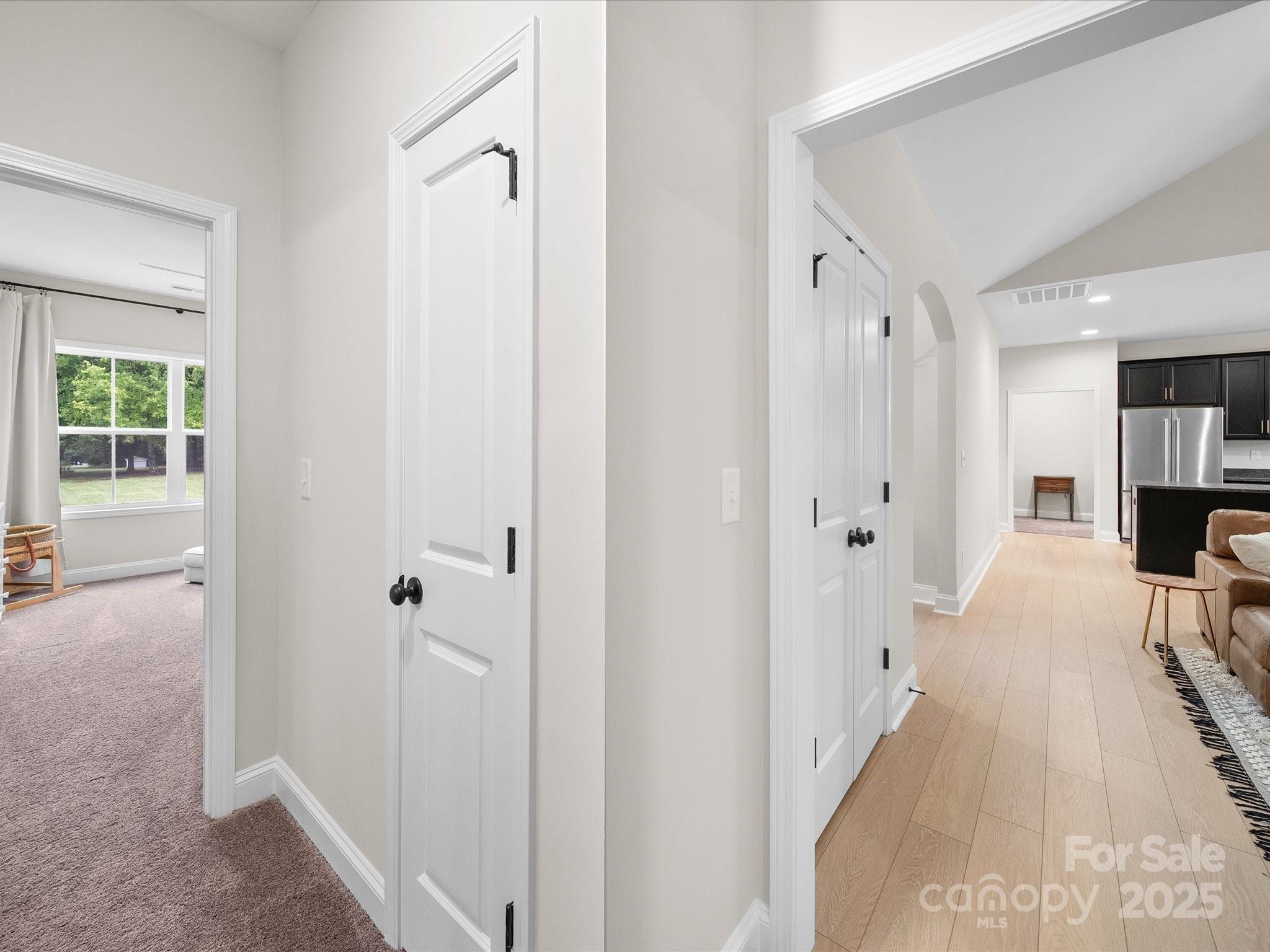 5408 Unionville Road Monroe, NC 28110 - Photo 23 of 31 a view of a hallway with wooden floor and a living room