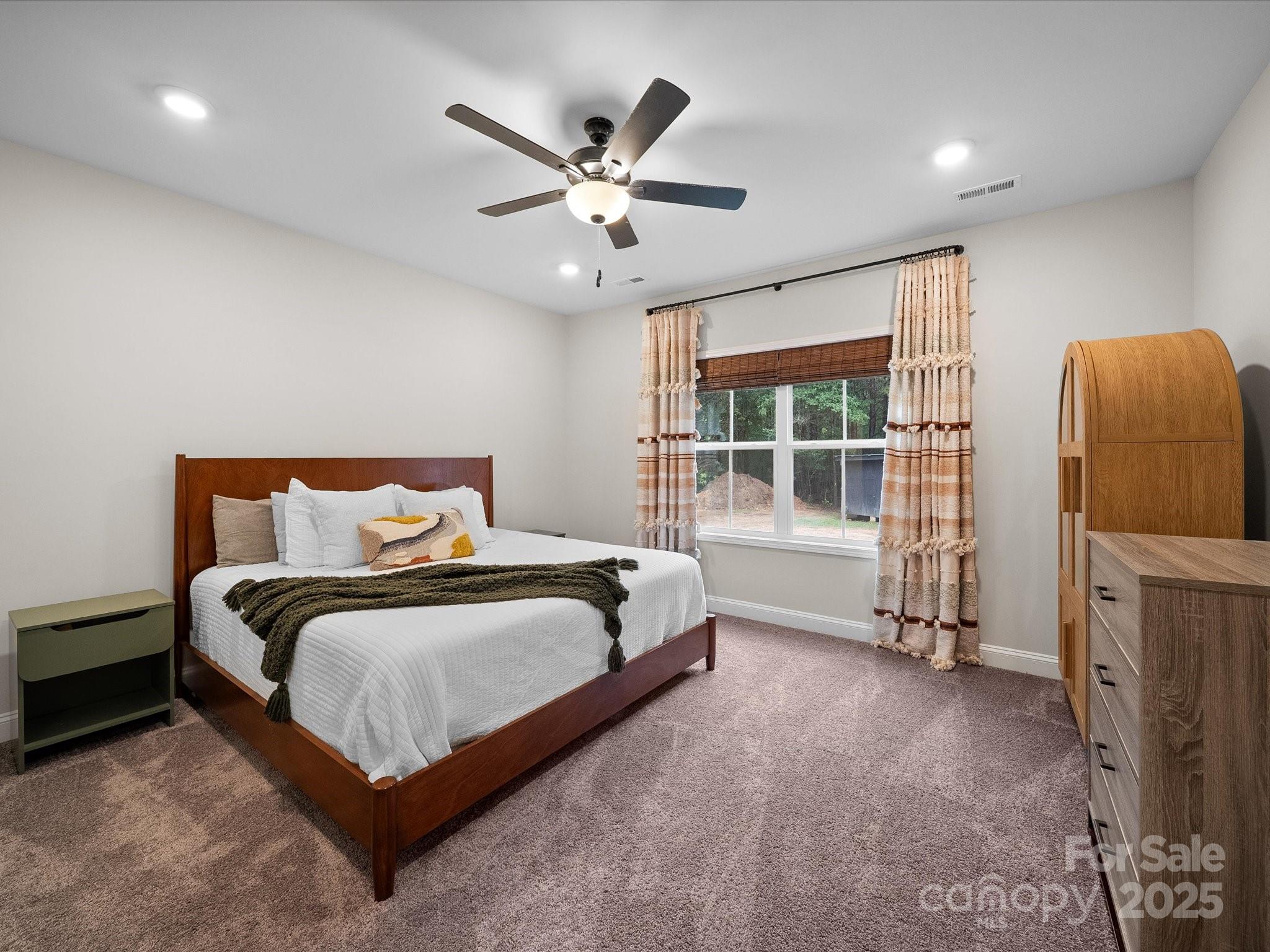 5408 Unionville Road Monroe, NC 28110 - Photo 5 of 31 a spacious bedroom with a bed and window