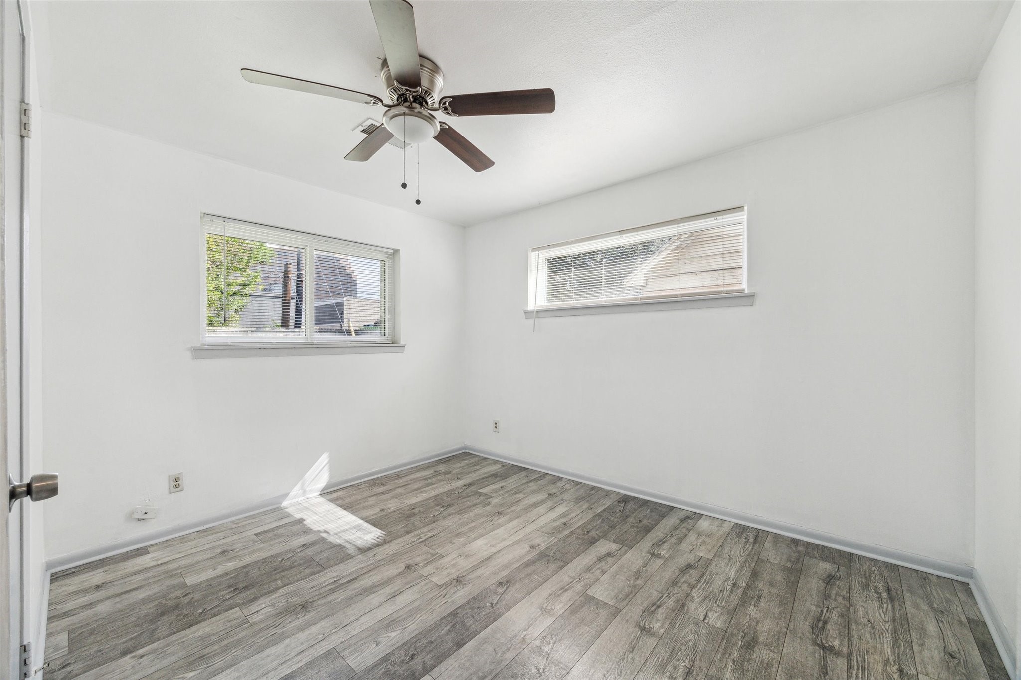 8814 Jason Street Houston, TX 77074 - Photo 7 of 14 a view of empty room with wooden floor