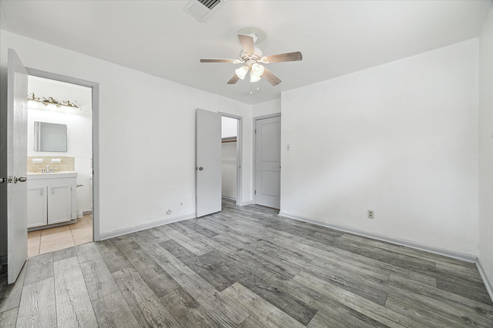 8814 Jason Street Houston, TX 77074 - Photo 8 of 14 a view of an empty room with wooden floor
