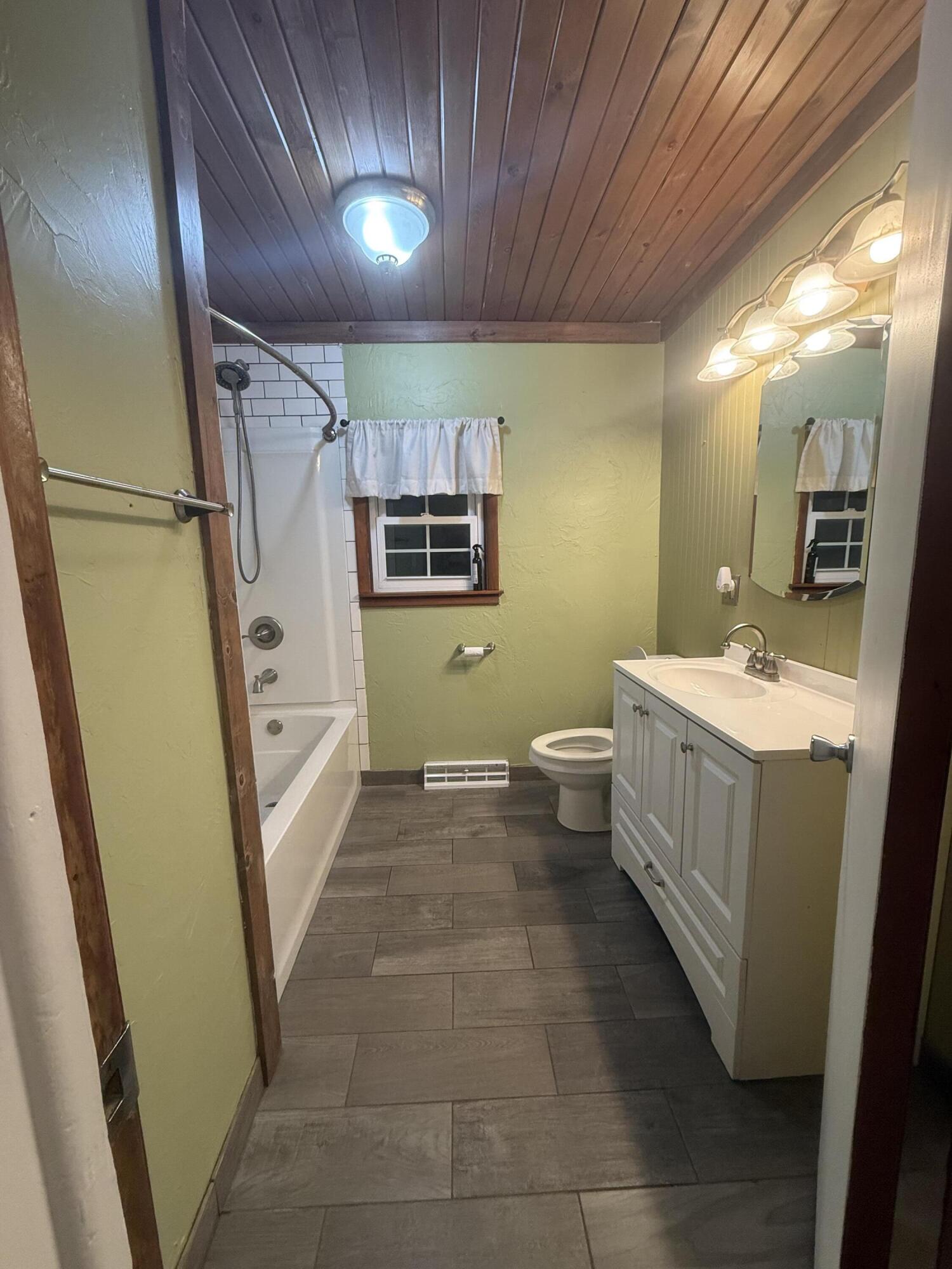 301 Hoffman Street Crown Point, IN 46307 - Photo 12 of 15 a bathroom with a sink a toilet and mirror