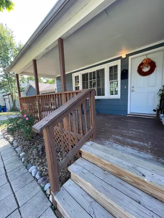 a view of a balcony with wooden floor