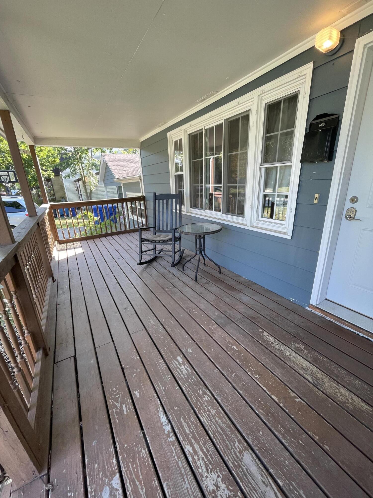 301 Hoffman Street Crown Point, IN 46307 - Photo 4 of 15 a view of a balcony with wooden floor