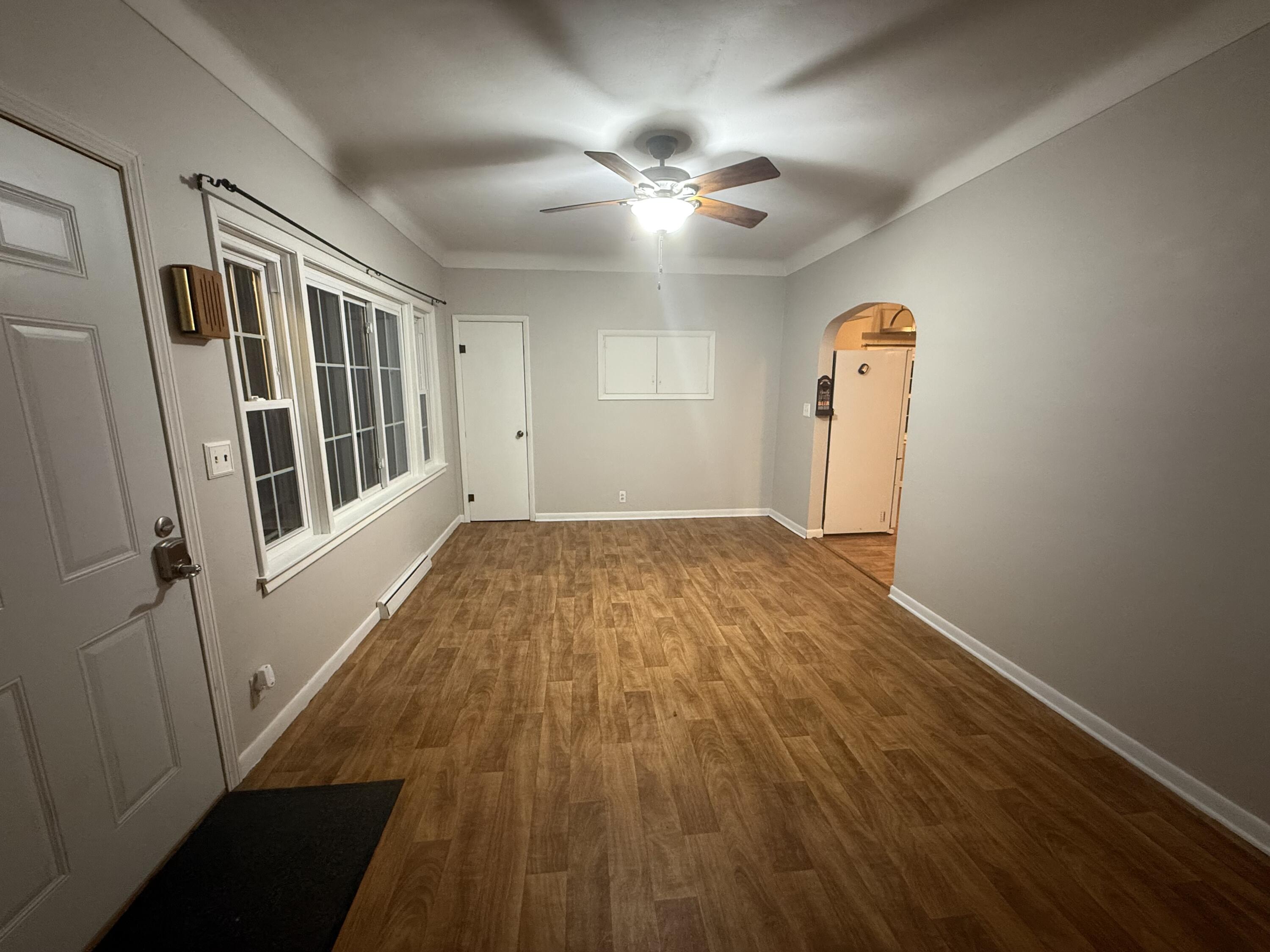 301 Hoffman Street Crown Point, IN 46307 - Photo 6 of 15 wooden floor in an empty room with a window