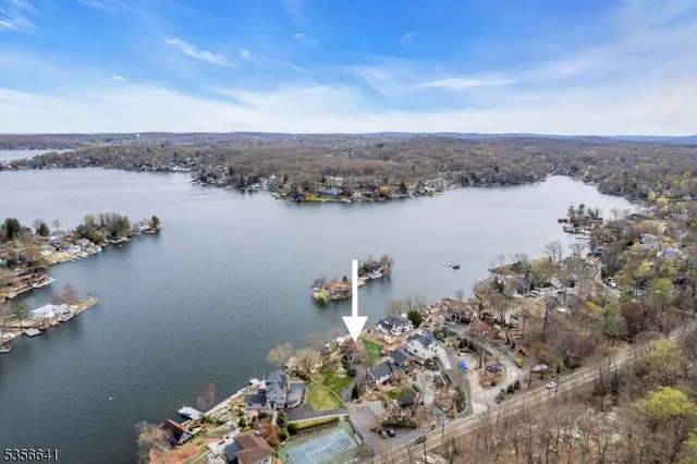 an aerial view of a house with a lake view