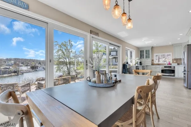 a view of a dining room with furniture window and outside view
