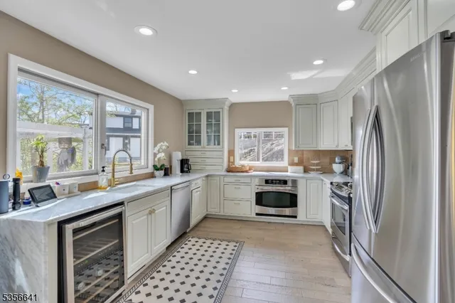 a kitchen with a sink stove and refrigerator
