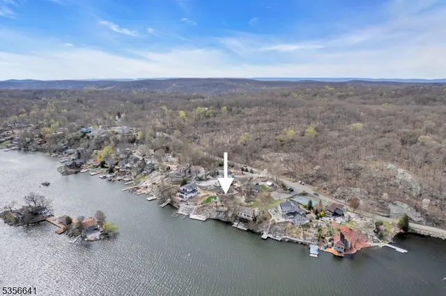 an aerial view of a house with a parking space