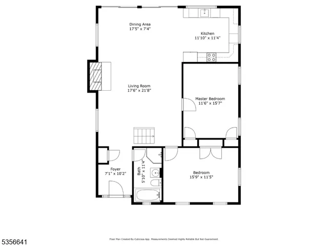 a picture of a bench in front of a wall