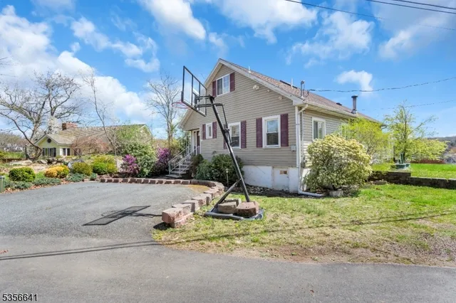 a house that has a tree in front of it