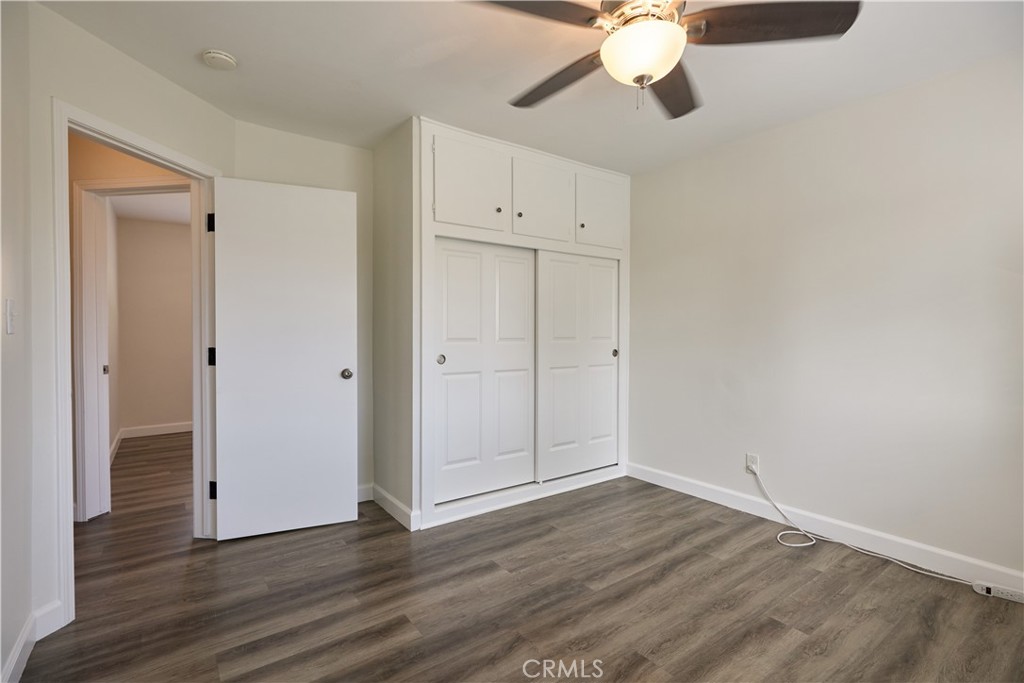 3644 Russell Street Riverside, CA 92501 - Photo 10 of 20 Bedroom one, complete with large closet, wall AC, and natural light from large window.