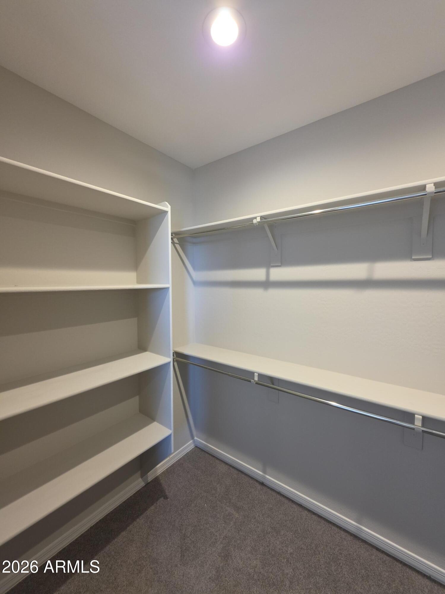 7128 West Coles Road Laveen, AZ 85339 - Photo 23 of 38 a view of an empty walk in closet