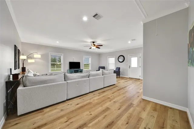 a bathroom with a sink toilet a mirror and shower