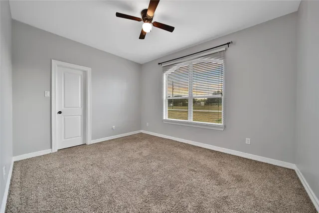 a utility room with cabinets washer and dryer