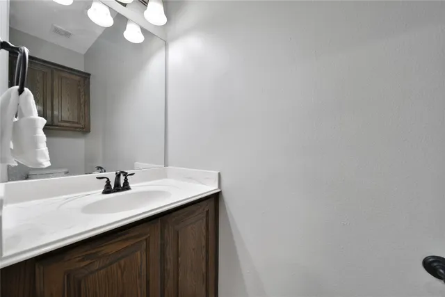 a view of a patio with a table chairs and a backyard