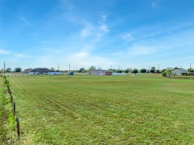 a view of a lake with houses in the background