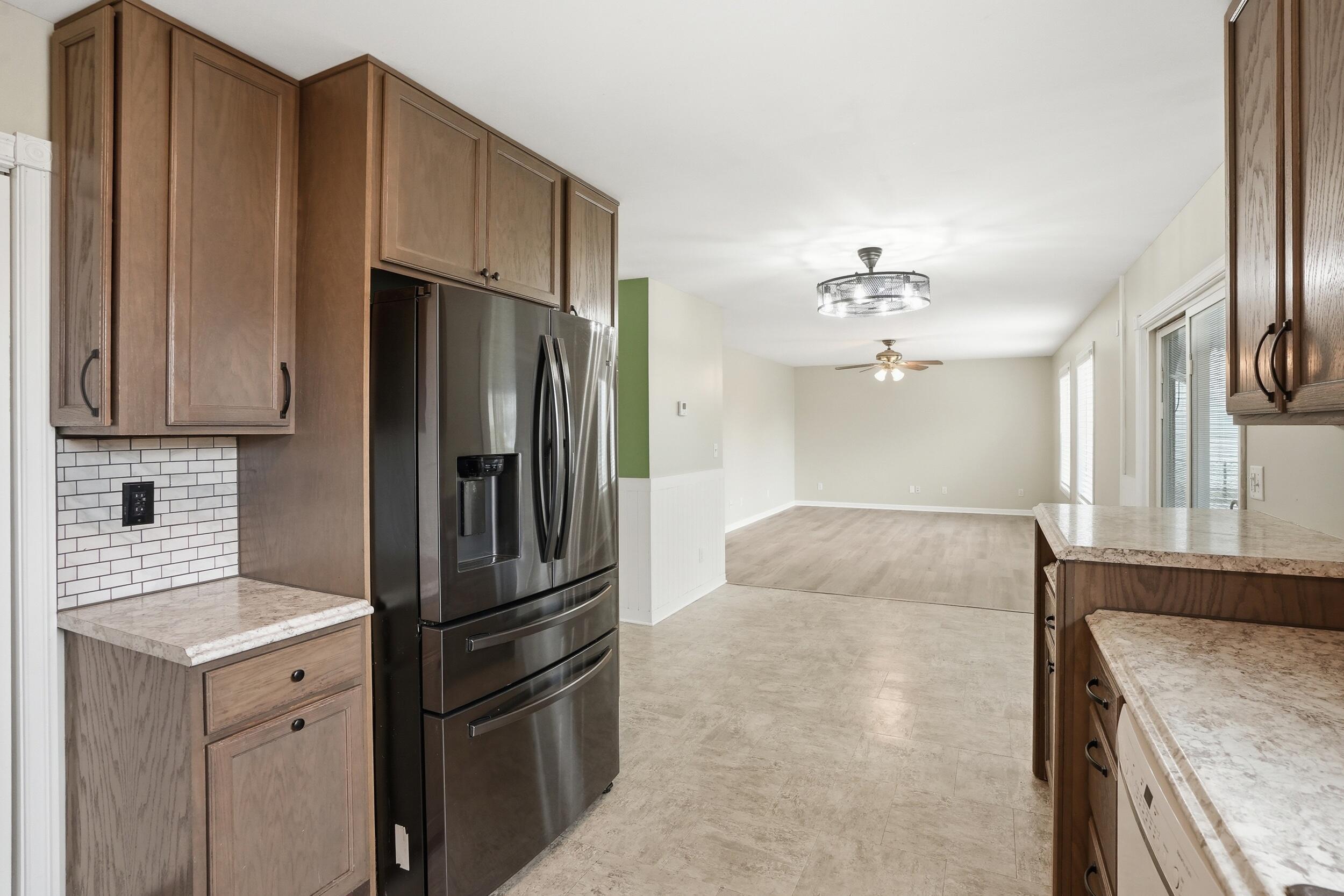 12358 Tippecanoe Place Crown Point, IN 46307 - Photo 13 of 30 a kitchen with stainless steel appliances granite countertop a refrigerator and a stove top oven