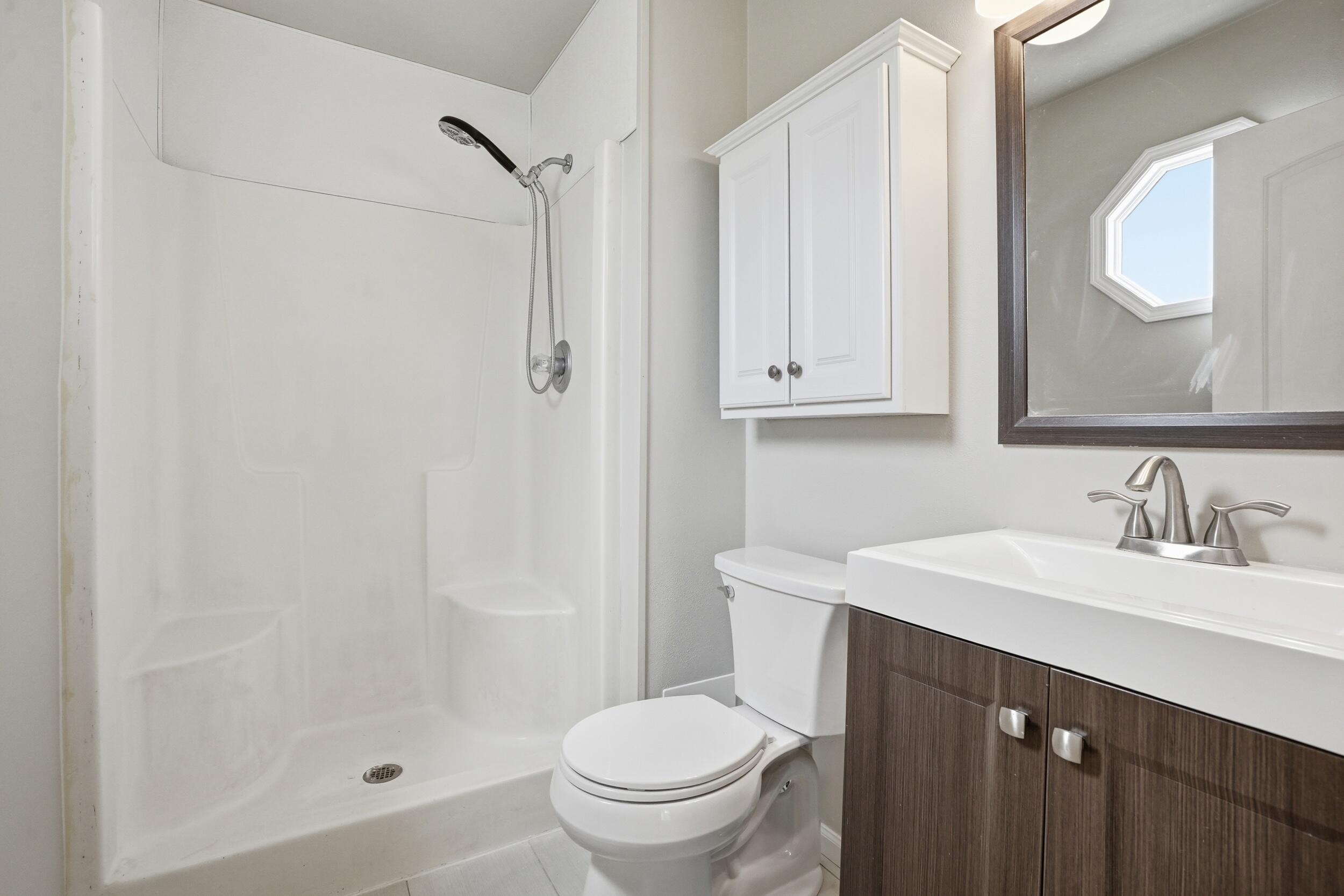 12358 Tippecanoe Place Crown Point, IN 46307 - Photo 17 of 30 a bathroom with a sink a toilet and shower