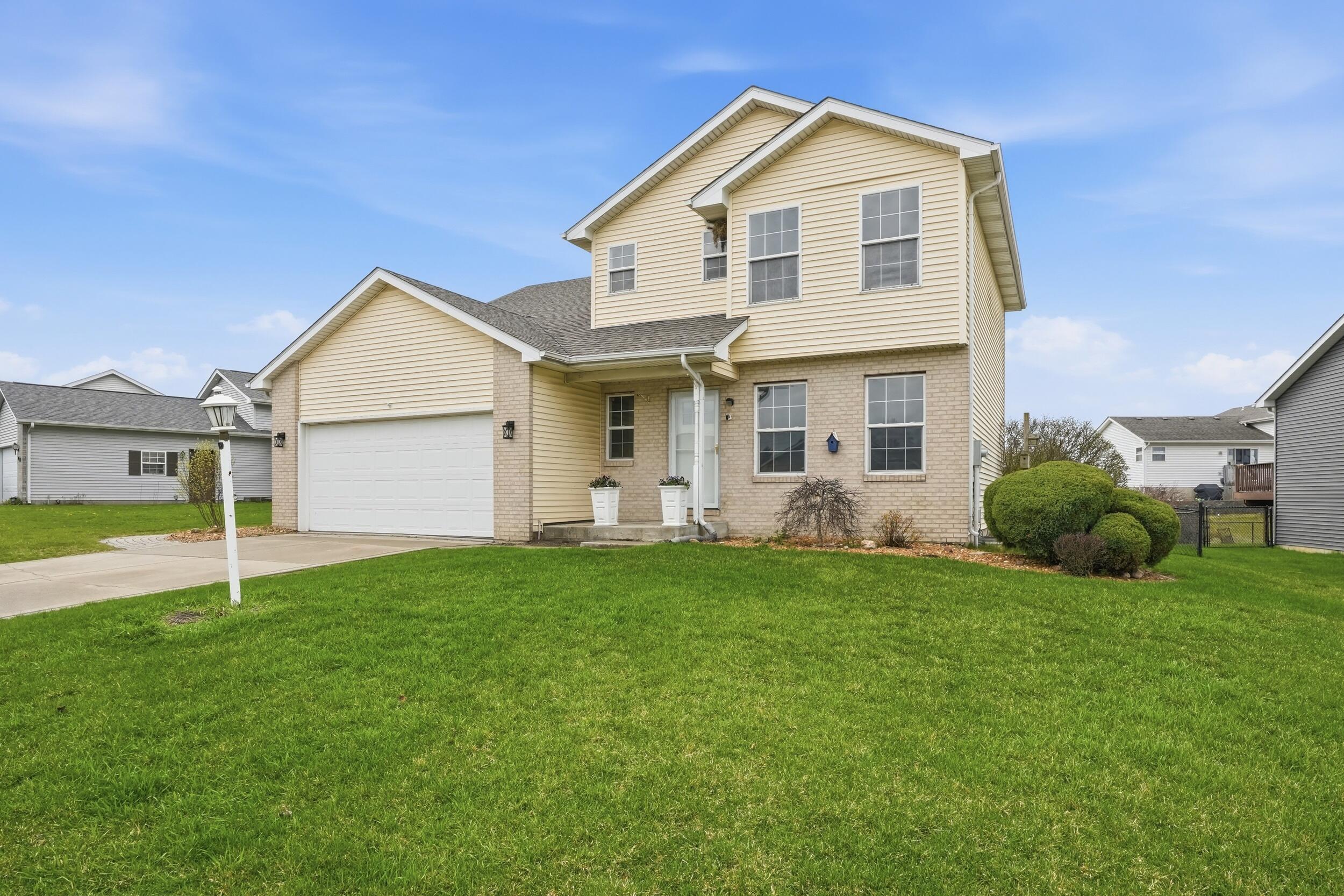 12358 Tippecanoe Place Crown Point, IN 46307 - Photo 29 of 30 a view of a house with a yard and a large tree