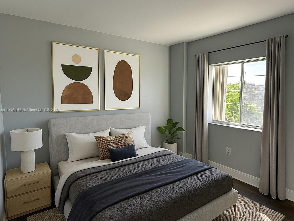 134 Southwest 7th Avenue, Unit 402 Miami, FL 33130 - Photo 13 of 19 a bedroom with a bed and closet