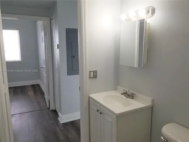 a bathroom with a sink and mirror
