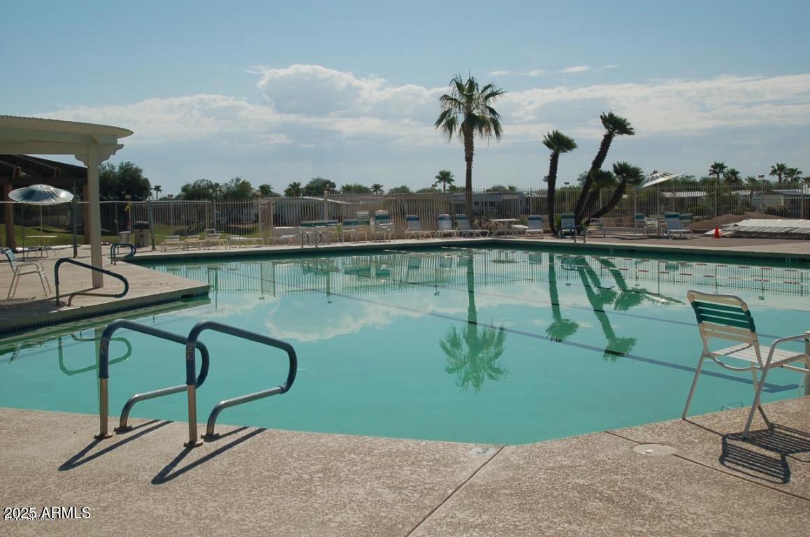17200 West Bell Road, Unit 612 Surprise, AZ 85374 - Photo 17 of 19 a view of a lake with couches chairs