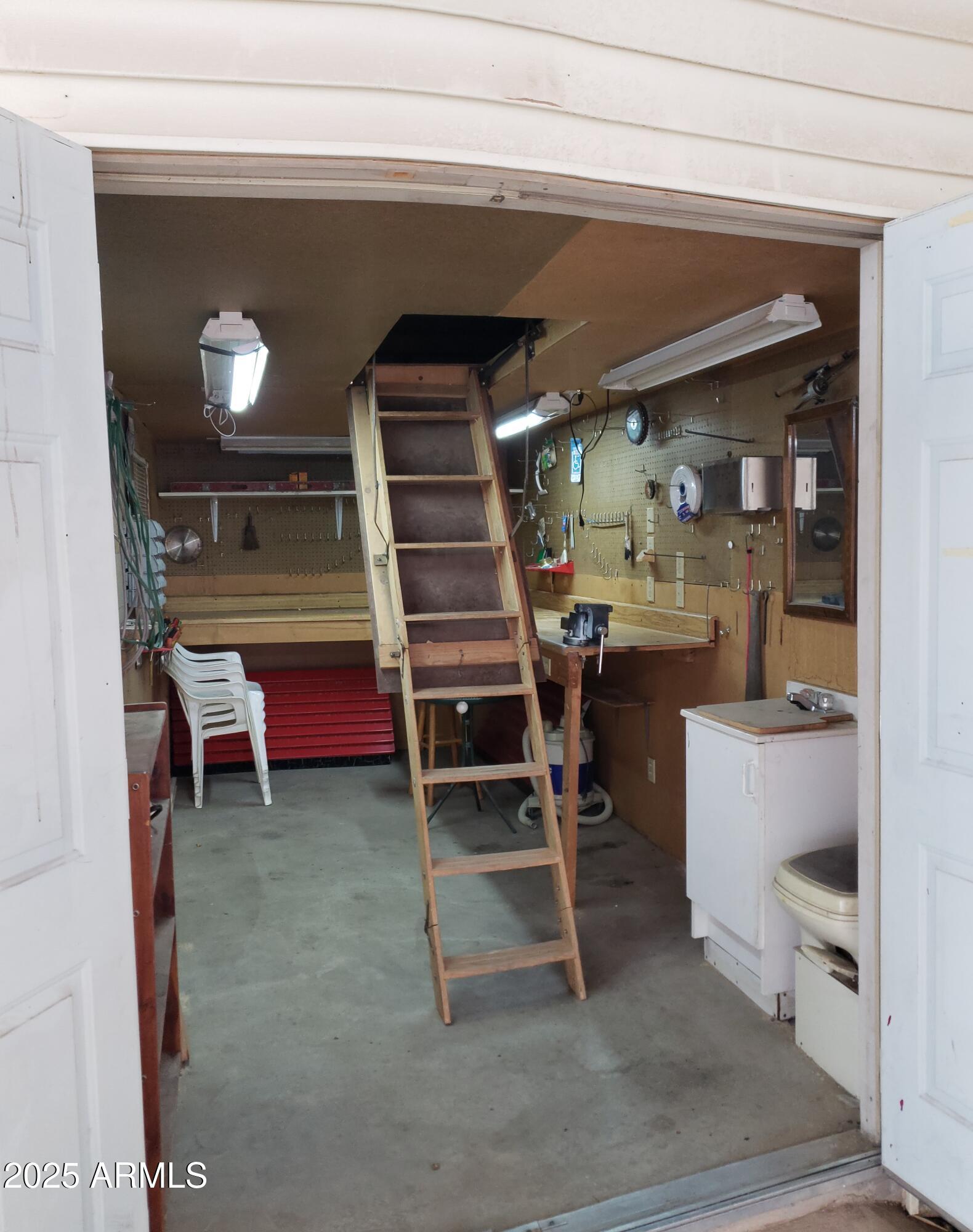 17200 West Bell Road, Unit 612 Surprise, AZ 85374 - Photo 6 of 19 a room with furniture and a chandelier