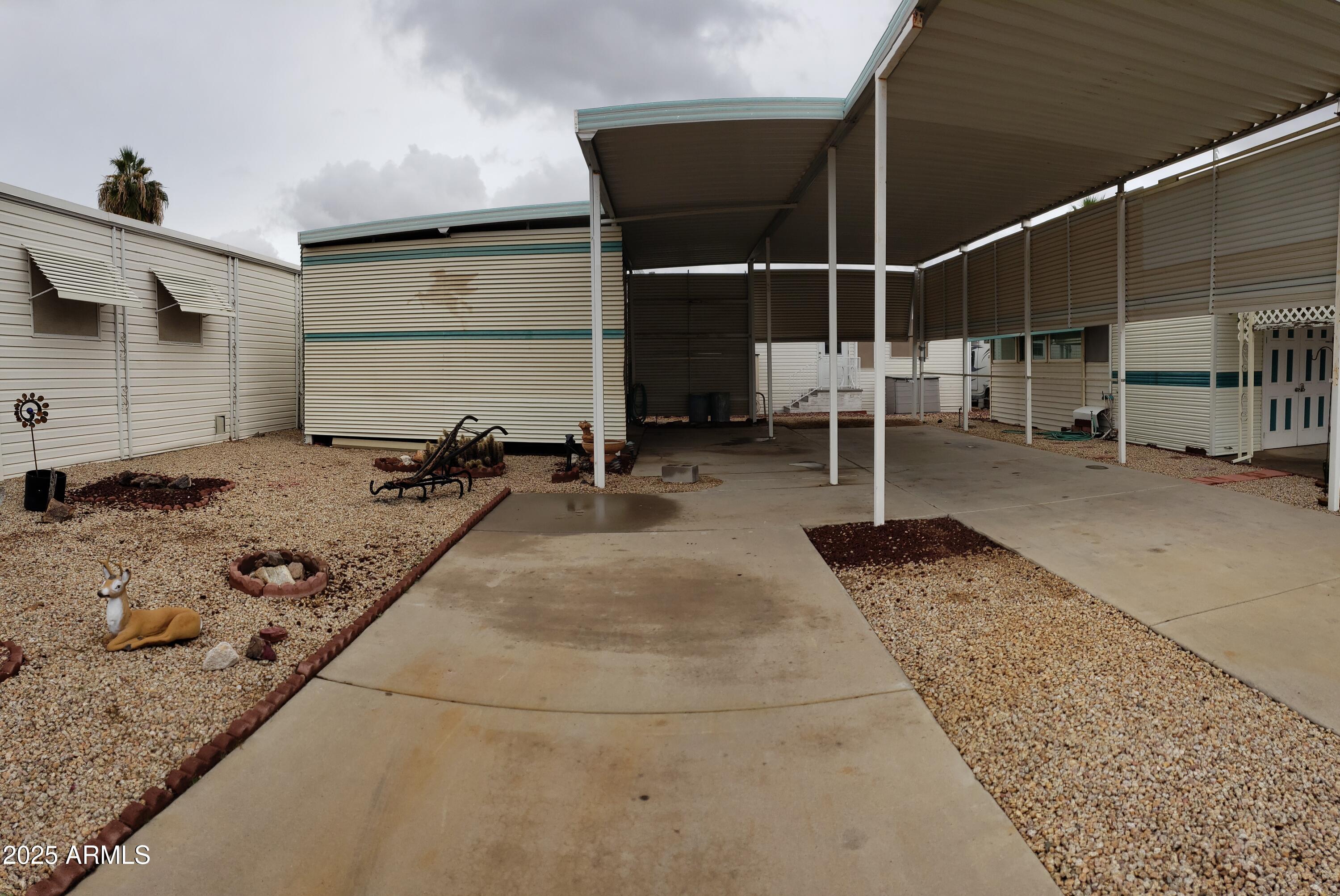 17200 West Bell Road, Unit 612 Surprise, AZ 85374 - Photo 7 of 19 a view of a chairs and table in backyard
