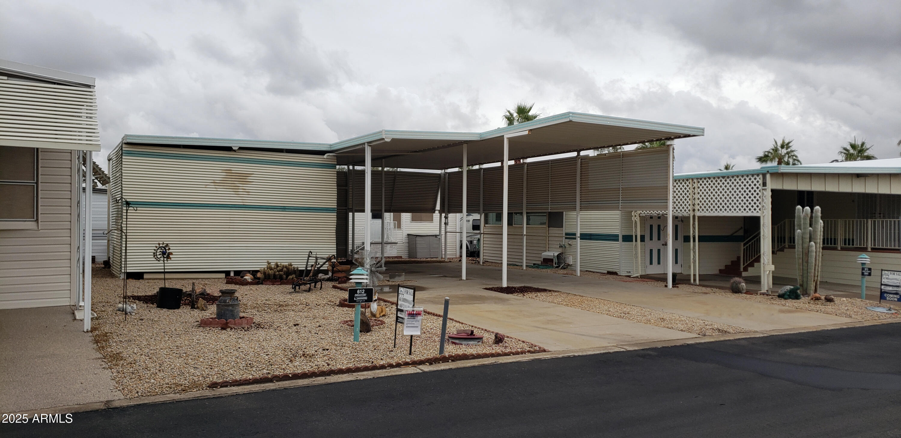 17200 West Bell Road, Unit 612 Surprise, AZ 85374 - Photo 8 of 19 a view of a house with sitting area and potted plants