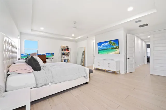 a bedroom with a bed and a walk in closet