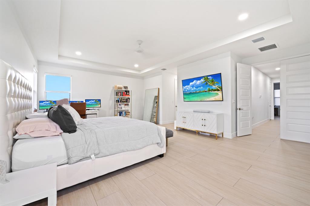 2001 Meadows Drive Davie, FL 33324 - Photo 16 of 40 a bedroom with a bed and a walk in closet