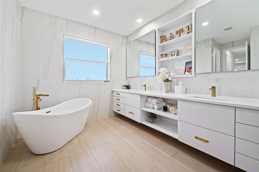 2001 Meadows Drive Davie, FL 33324 - Photo 17 of 40 a bathroom with a double vanity sink mirror and bathtub