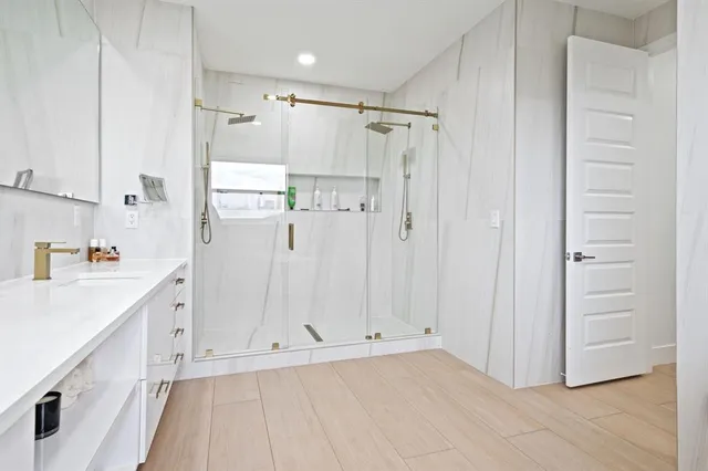 a view of kitchen with white cabinets