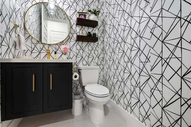 a bathroom with a toilet and a sink