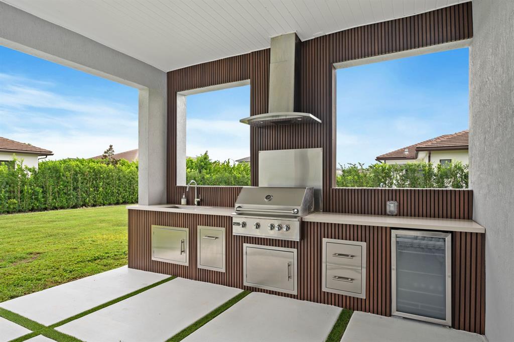 2001 Meadows Drive Davie, FL 33324 - Photo 2 of 40 a open kitchen with stainless steel appliances granite countertop a stove a sink and a yard