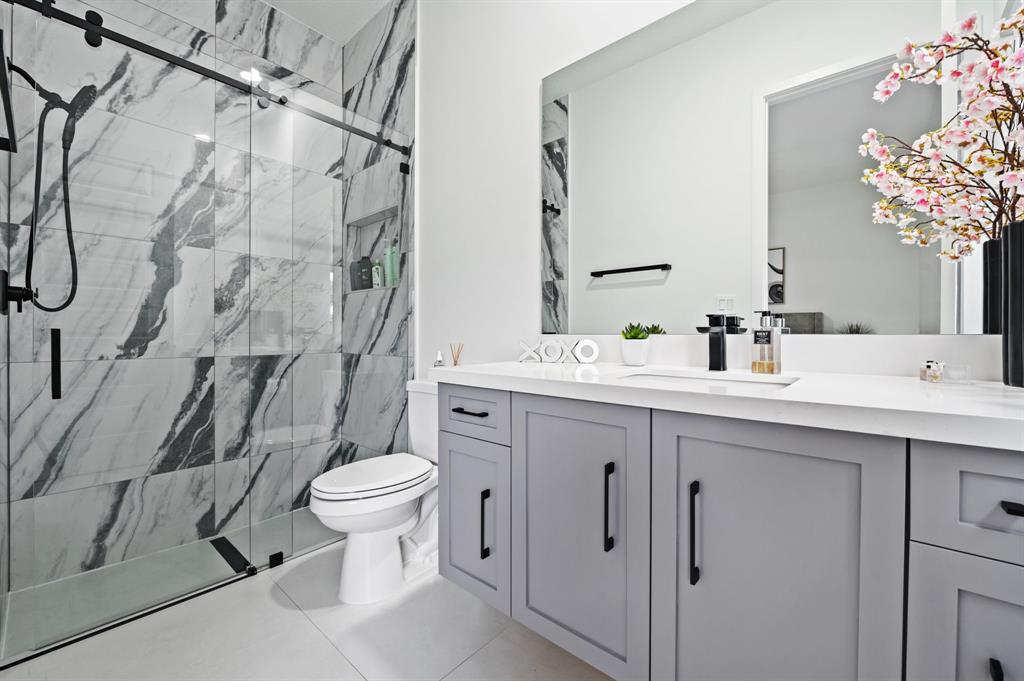 2001 Meadows Drive Davie, FL 33324 - Photo 22 of 40 a bathroom with a sink toilet and shower