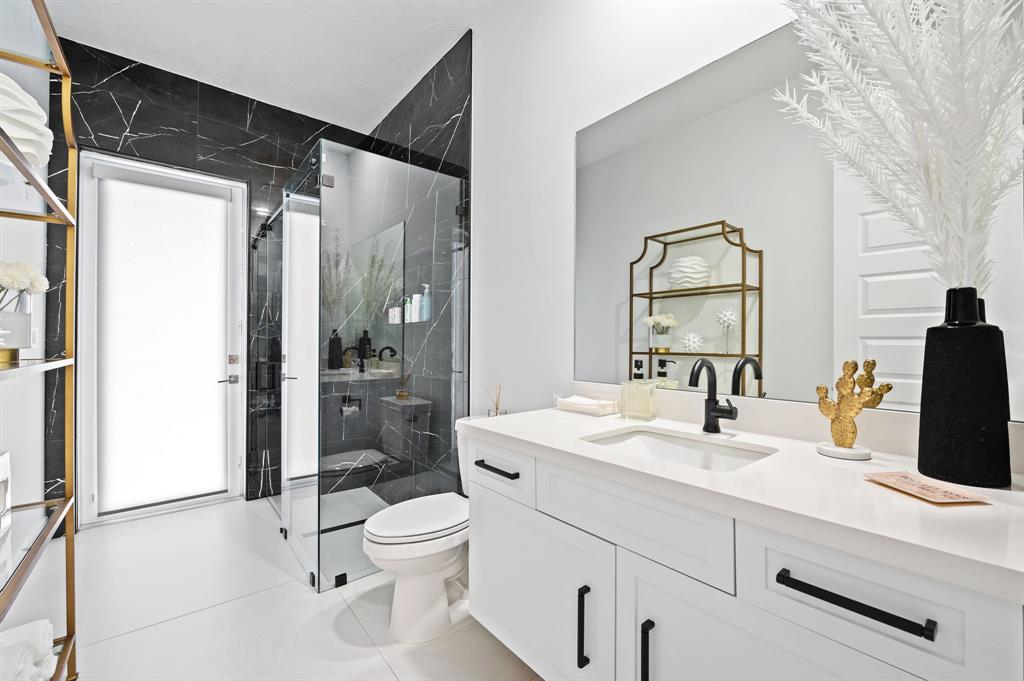 2001 Meadows Drive Davie, FL 33324 - Photo 24 of 40 a bathroom with a sink toilet and shower