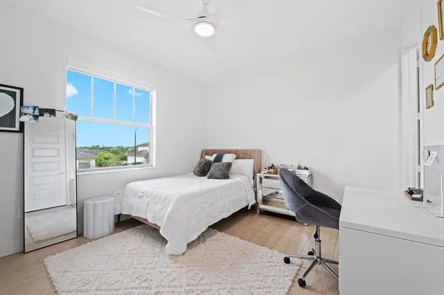 a bedroom with a bed and a table in it