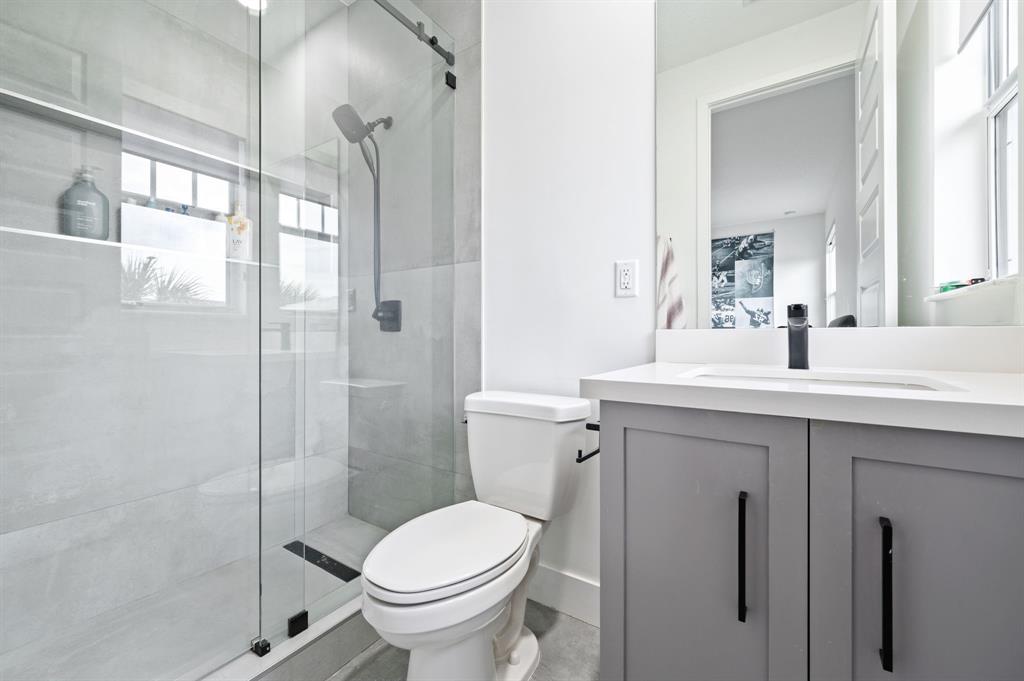 2001 Meadows Drive Davie, FL 33324 - Photo 26 of 40 a bathroom with a sink toilet and shower