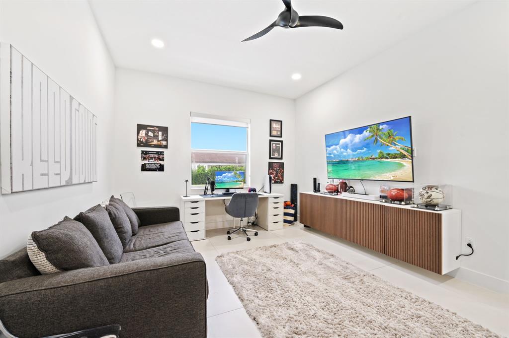 2001 Meadows Drive Davie, FL 33324 - Photo 30 of 40 a living room with furniture and a flat screen tv