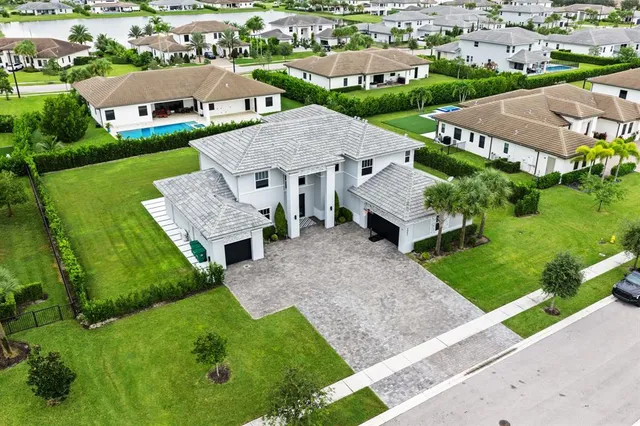 an aerial view of a house with a garden